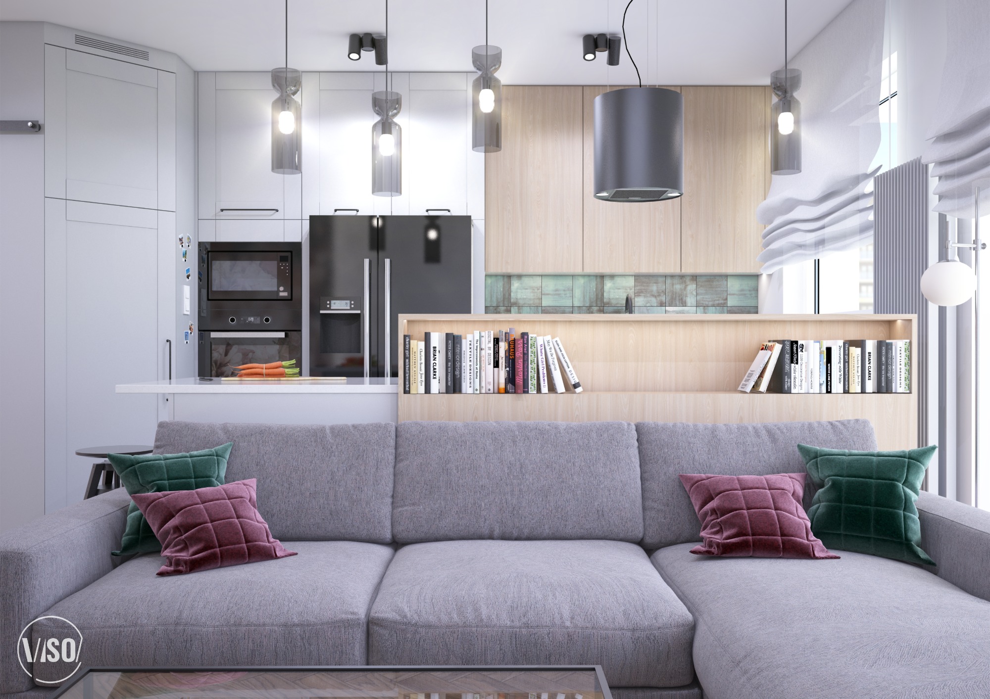 Wnętrze mieszkania w stylu nowoczesnym: szara sofa z zielonymi i bordowymi poduszkami, półka z książkami, kuchnia z białymi i drewnianymi szafkami, czarny sprzęt AGD i designerskie lampy wiszące.