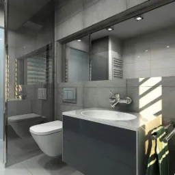 Nowoczesna łazienka w odcieniach szarości z kabiną prysznicową typu walk-in, podwieszaną toaletą i umywalką wpuszczoną w szafkę z ciemnoszarym frontem, oświetlona promieniami słońca padającymi...