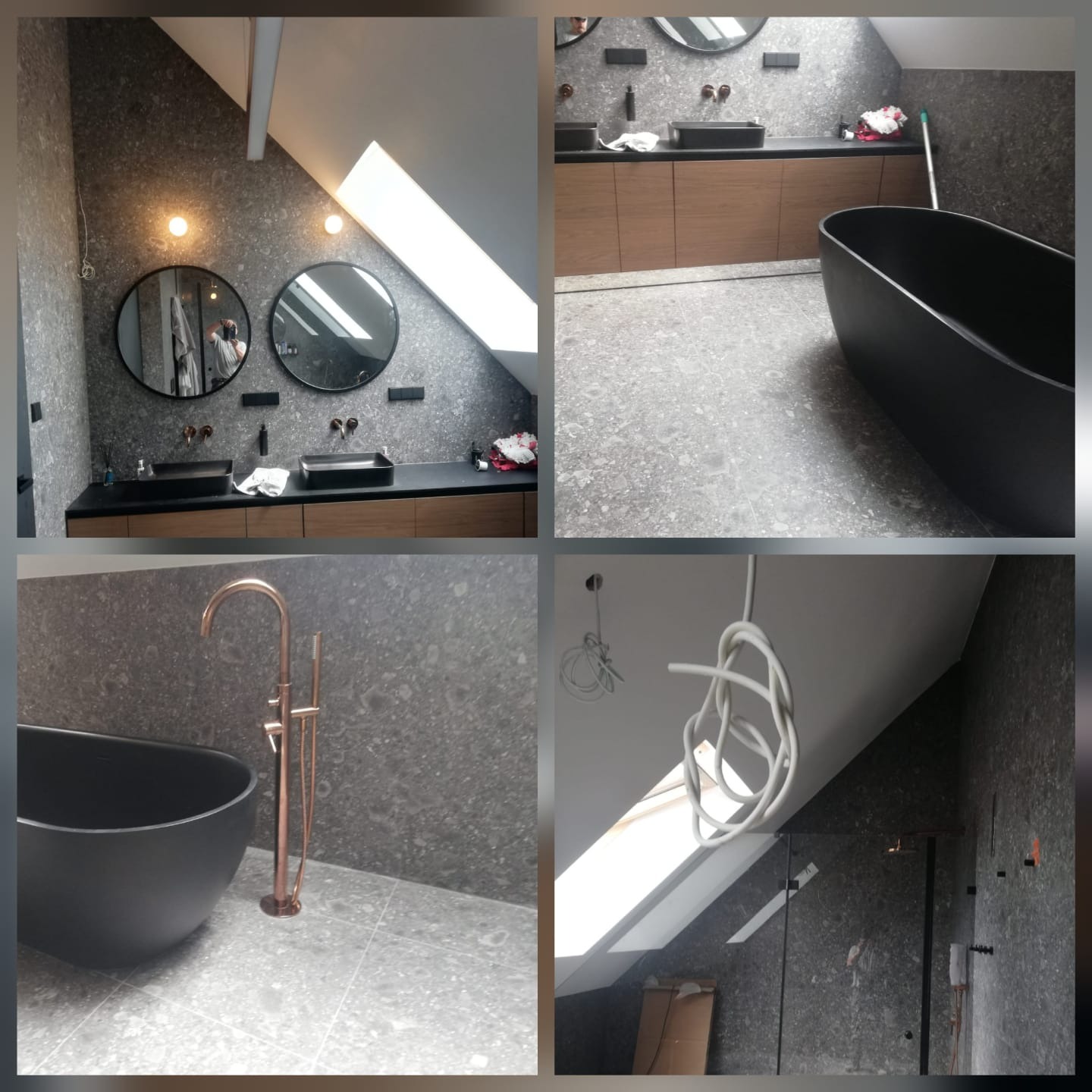 Nowoczesna łazienka na poddaszu z czarną wanną wolnostojącą, grafitową mozaiką i elementami miedzianymi. Widoczne okno dachowe i minimalistyczne umywalki.