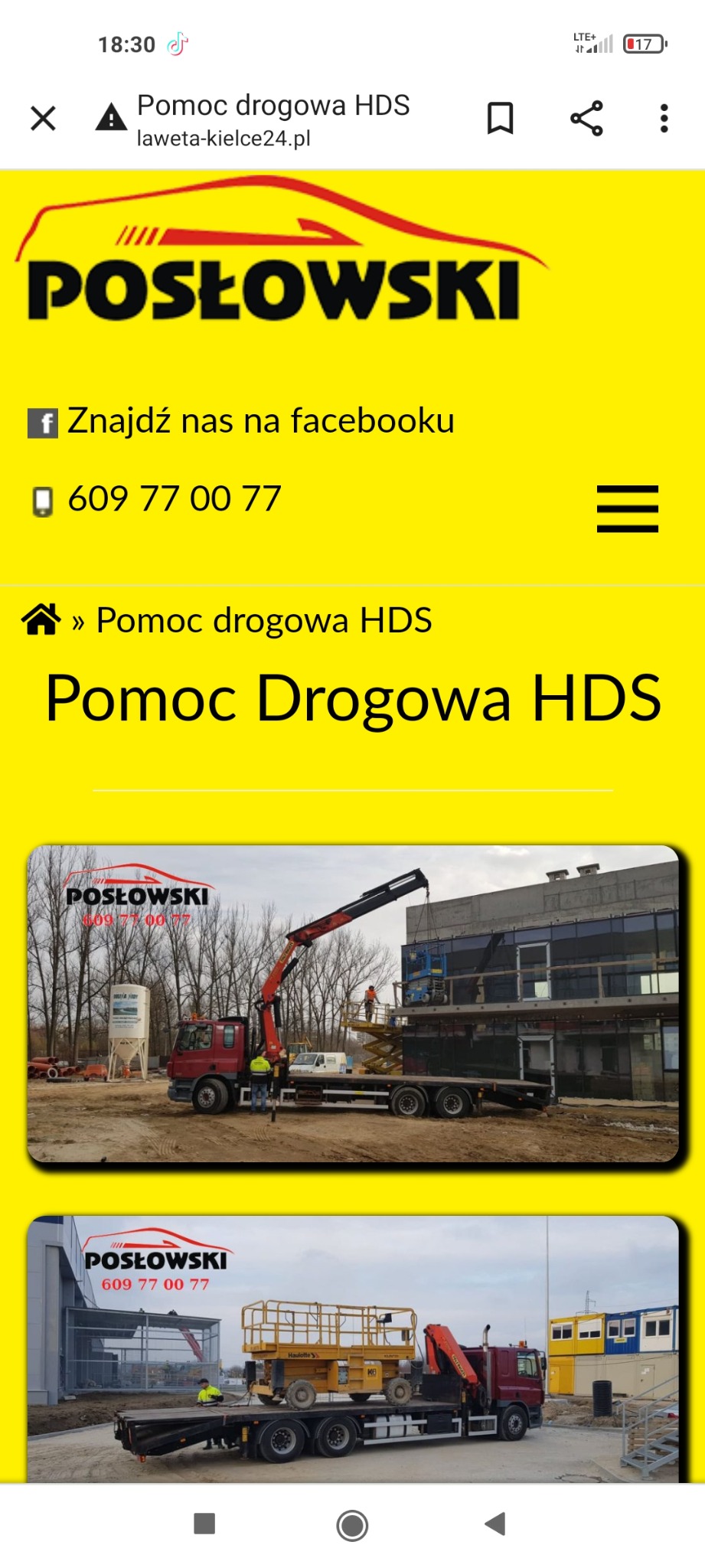 Ciężarówka z dźwigiem HDS podnosi podnośnik koszowy na placu budowy, widoczni robotnicy w kamizelkach odblaskowych.