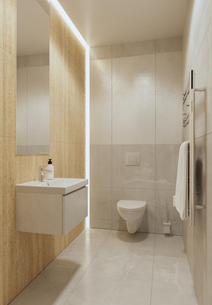 Neutralna łazienka z beżowymi płytkami imitującymi drewno na jednej ścianie, podświetlanym lustrem, wiszącą szafką z umywalką, toaletą, grzejnikiem drabinkowym z ręcznikiem i płytkami imitującymi...