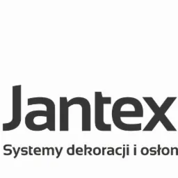 Logo firmy Jantex z Chełma, specjalizującej się w systemach dekoracji i osłon okiennych, z abstrakcyjnym symbolem w kolorach fioletowym i złotym.