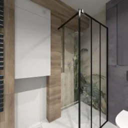 Nowoczesna łazienka z kabiną prysznicową typu walk-in z czarnymi profilami, grzejnikiem drabinkowym, zabudową z drewnopodobnych paneli i białą szafką wiszącą.