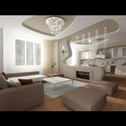 Nowoczesny salon z sufitem podwieszanym, dekoracyjną ścianką działową z kominkiem, beżową sofą i widokiem na kuchnię.