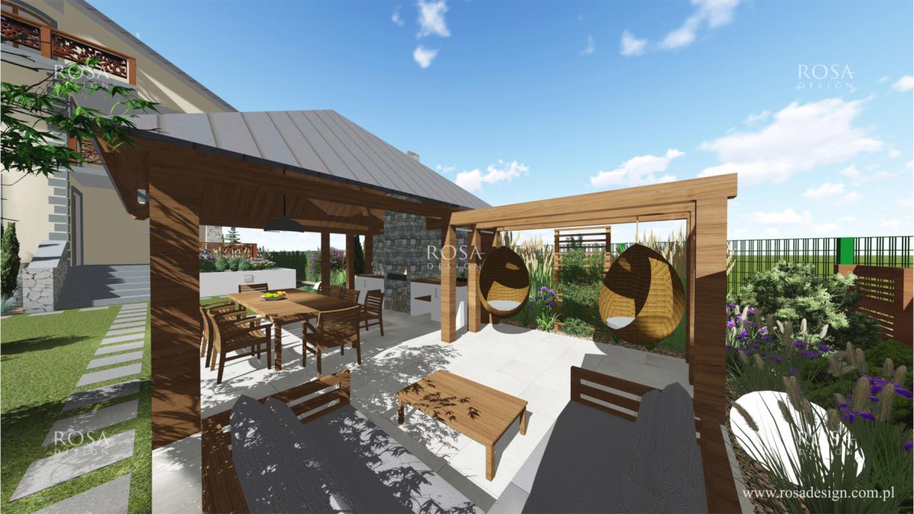 Wizualizacja zadaszonego tarasu z meblami ogrodowymi, wiszącymi fotelami i kamiennym grillem, otoczonego zielenią i kwiatami.