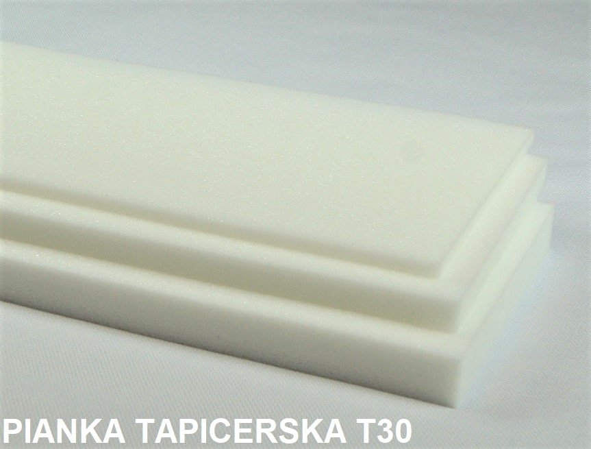 Białe, prostokątne arkusze pianki tapicerskiej T30 ułożone jeden na drugim, widoczne warstwy i struktura materiału.