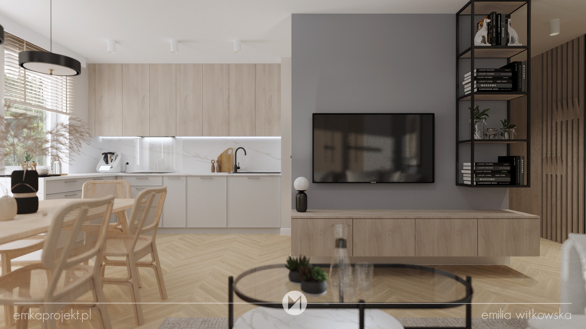 Wnętrze salonu z aneksem kuchennym w jasnych barwach: drewniana podłoga ułożona w jodełkę, beżowe meble kuchenne z białym blatem, stół z rattanowymi krzesłami, szara ściana z telewizorem i półką...