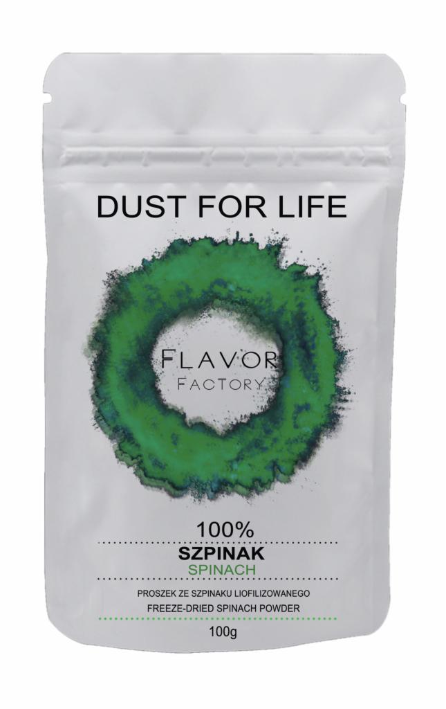 Białe opakowanie z napisem 'Dust for Life' i 'Flavor Factory', prezentujące liofilizowany szpinak w proszku w okrągłej ramce z zielonego proszku.