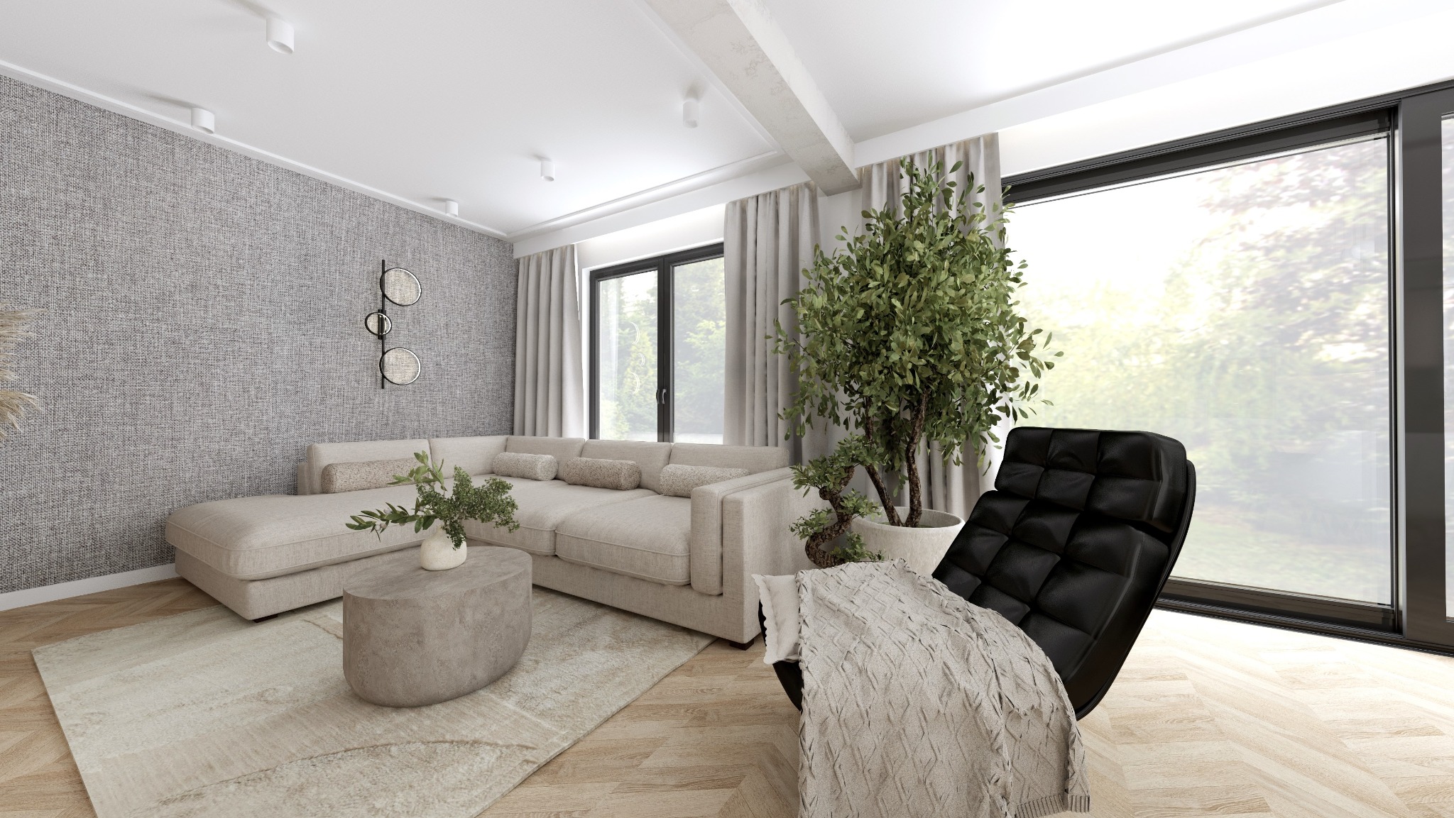 Jasny salon z teksturowaną szarą ścianą, beżową sofą narożną, okrągłym stolikiem kawowym, czarnym fotelem z pikowaniem i dużym oknem z widokiem na zieleń.