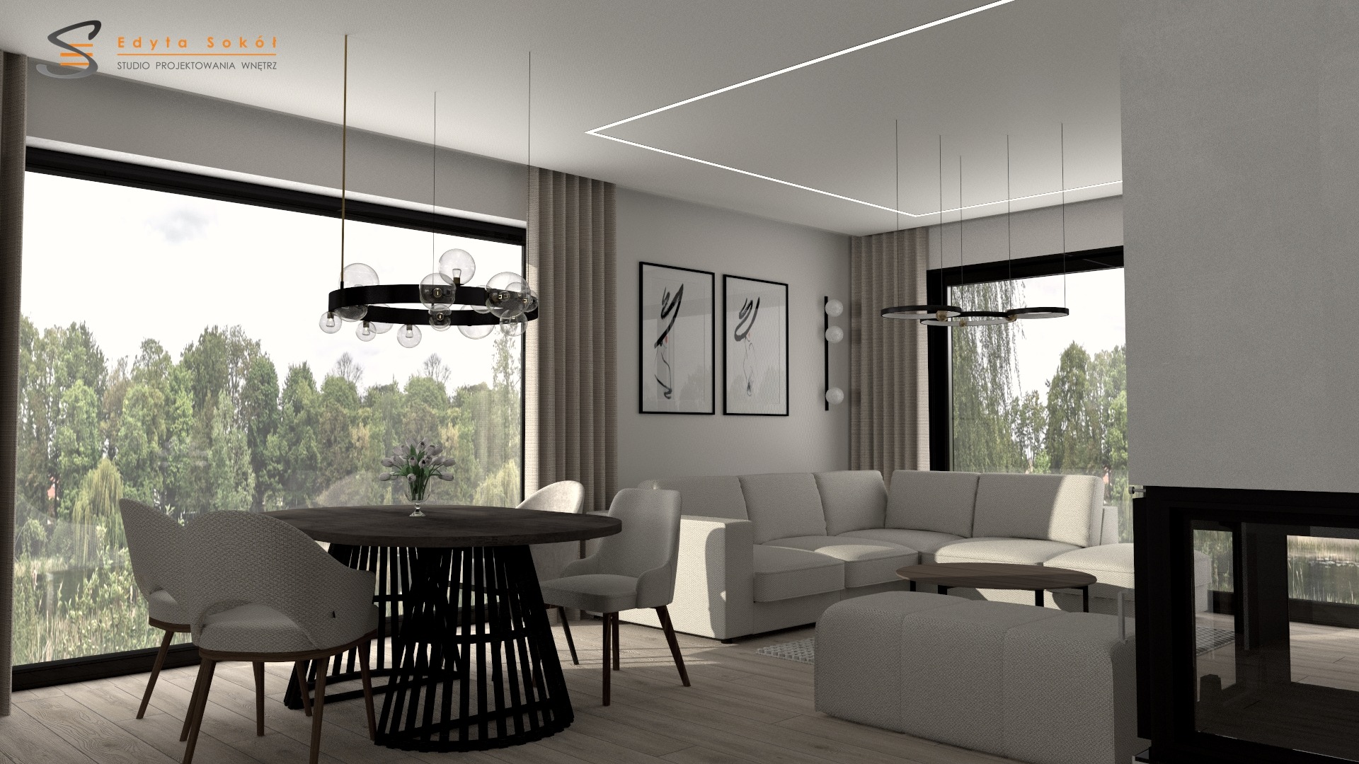 Wizualizacja przestronnego salonu z dużym oknem z widokiem na las, okrągłym stołem z czarną podstawą, szarą sofą narożną i nowoczesnym oświetleniem.