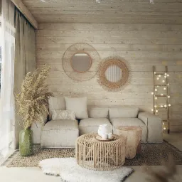 Jasne wnętrze salonu w stylu boho z drewnianą boazerią, beżową sofą modułową, okrągłym stolikiem z rattanu, dekoracyjnymi lustrami z trawy morskiej i drabiną z lampkami.