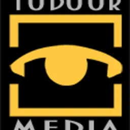 Logo firmy TODOR MEDIA w kolorach czarnym, szarym i złotym, przedstawiające stylizowane oko w kwadratowej ramce.