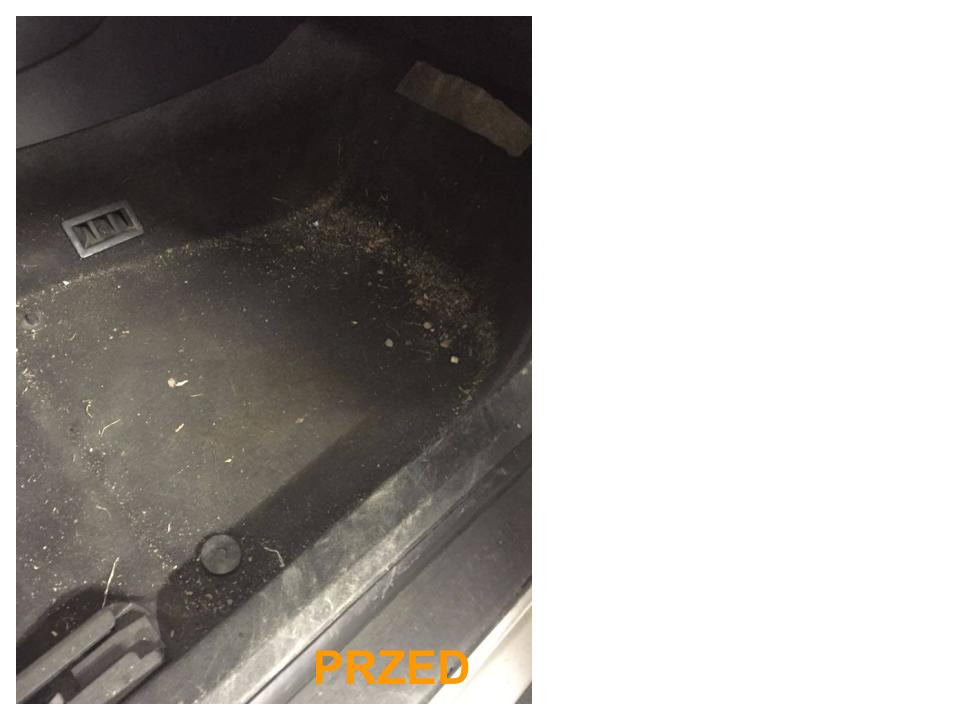 Brudna, czarna wykładzina podłogowa w samochodzie, widoczne okruchy, piasek i kurz, z napisem 'PRZED' w rogu.