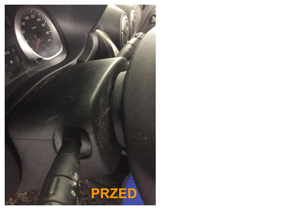 Brudna deska rozdzielcza i kierownica samochodu z widocznym napisem 'PRZED' w dolnym rogu.