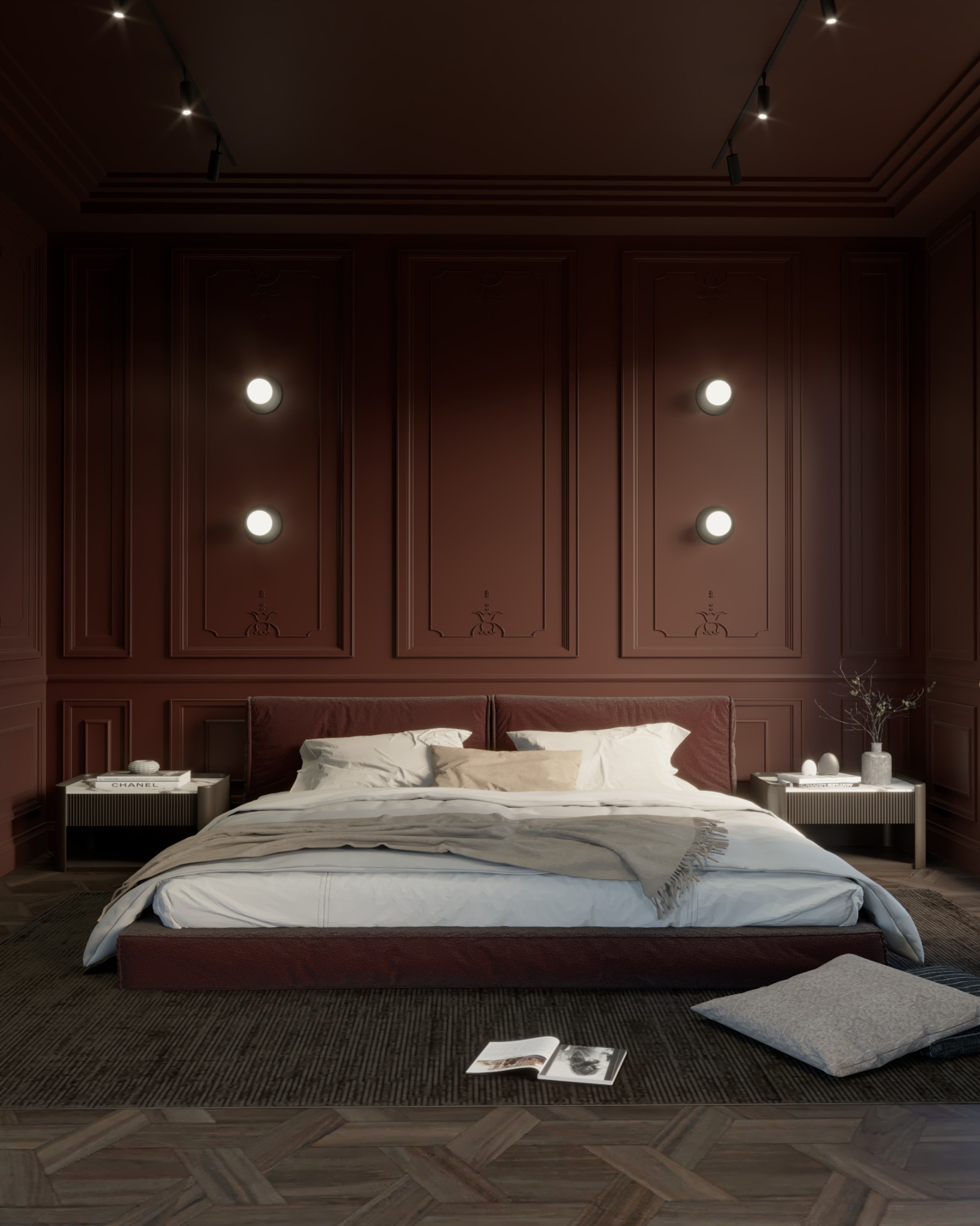Elegancka sypialnia w odcieniach bordo z parkietem w jodełkę. Na stolikach nocnych książki i dekoracje. Oświetlenie punktowe na suficie i ścianie.