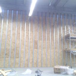 Firma Ogólnobudowlana Marcin Lichosik - Ściana działowa GK wysokość 9m długość 15m w hali magazynowej, ocieplenie/wyciszenie wełną
