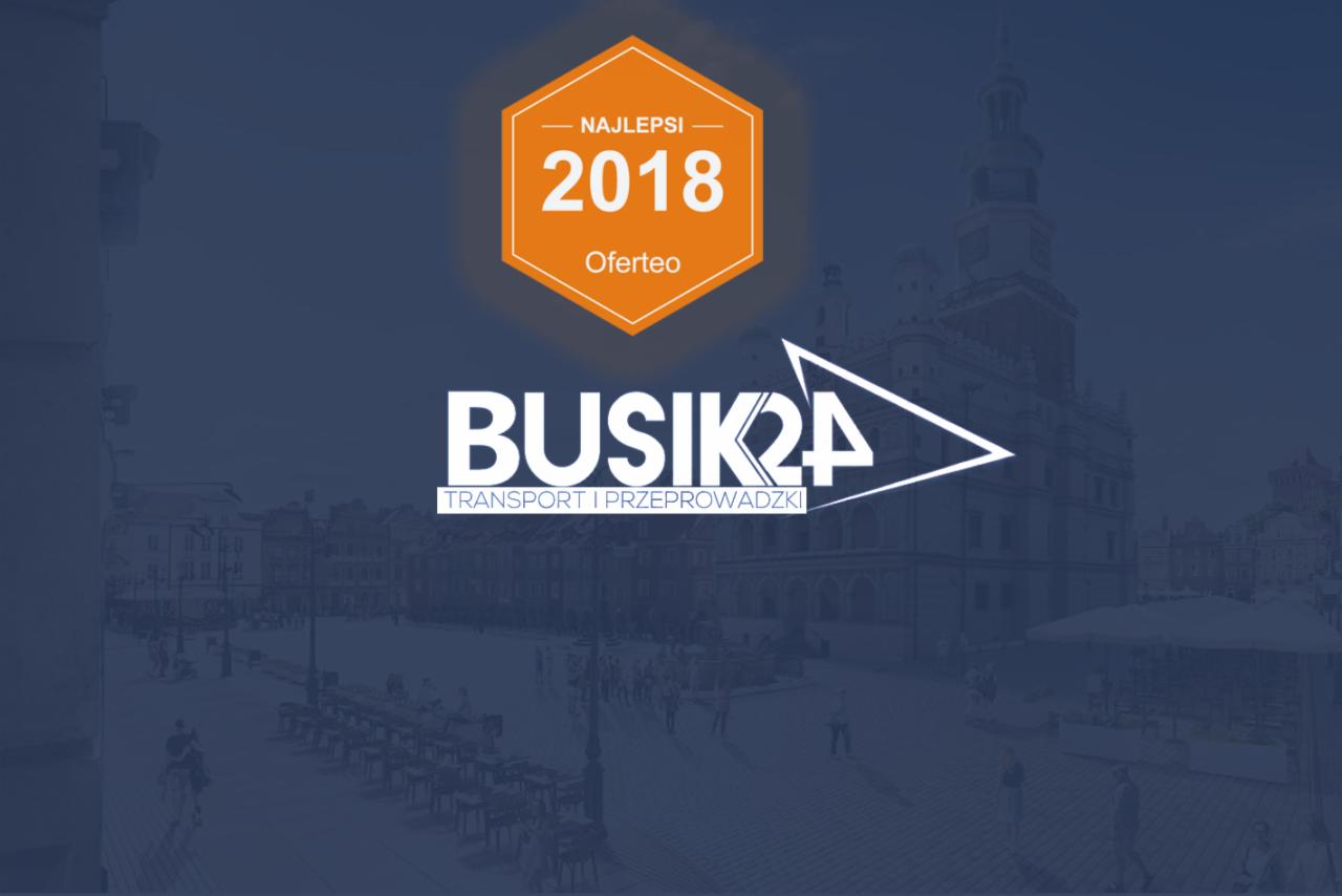 Logo firmy transportowej BUSIK24 z nagrodą Oferteo Najlepsi 2018 na tle panoramy miasta.