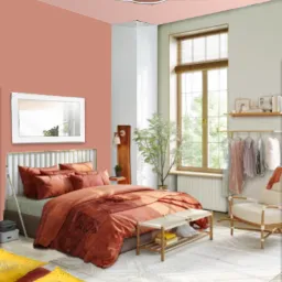 Wizualizacja sypialni w odcieniach terakoty w Warszawie, z dekoracyjną lampą sufitową, łóżkiem z wzorzystą narzutą i jasnym dywanem.