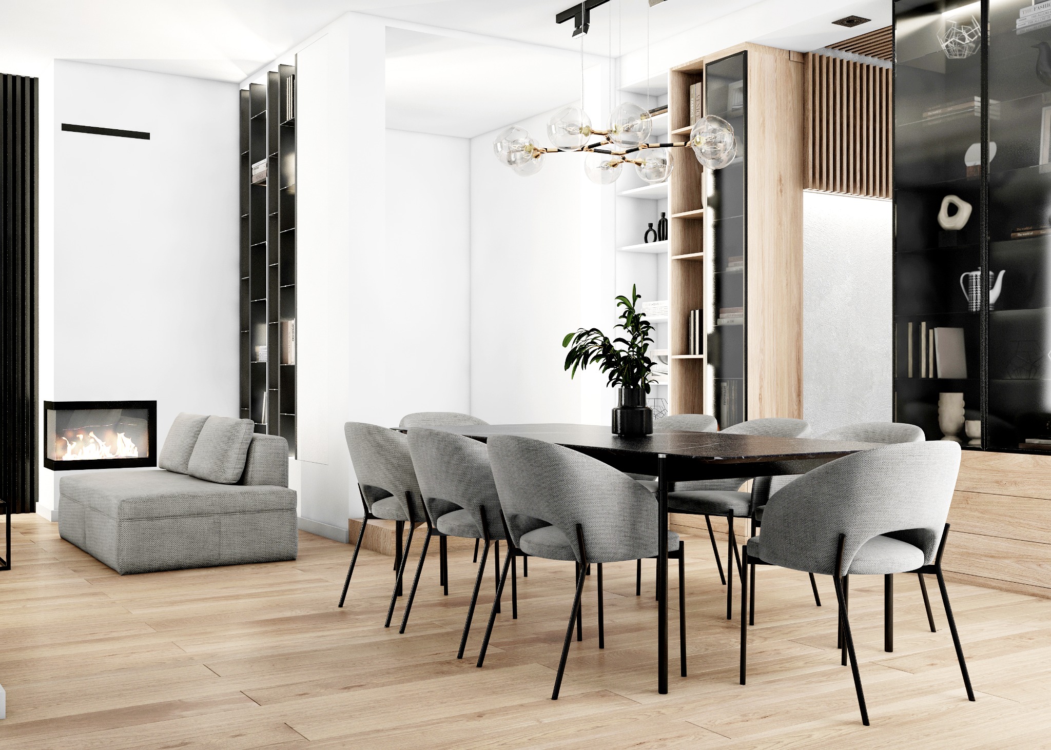 Jasne, nowoczesne wnętrze z drewnianą podłogą, szarym narożnikiem przy kominku i stołem jadalnym z szarymi krzesłami, nad którym wisi designerska lampa. W tle widoczny regał z drewnianymi...