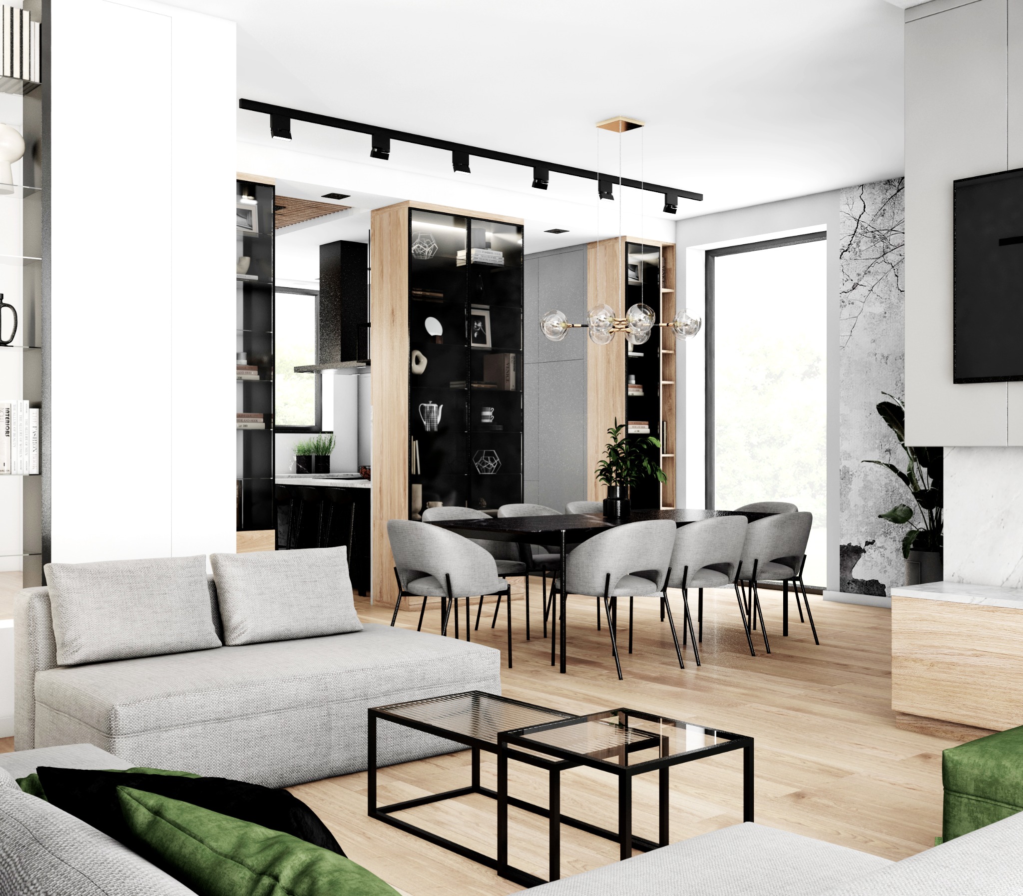 Nowoczesne wnętrze salonu z otwartą kuchnią, szary narożnik z zielonymi poduszkami, szklane stoliki kawowe, stół z szarymi krzesłami, oświetlenie szynowe i dekoracyjna lampa wisząca, ściana...