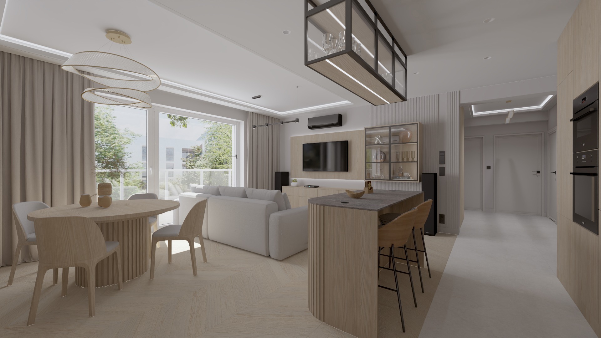 Jasne, przestronne wnętrze mieszkania z drewnianą podłogą w jodełkę, okrągłym stołem jadalnym z krzesłami, białym narożnikiem, wyspą kuchenną z hokerami i ścianą TV z szafką i witryną.