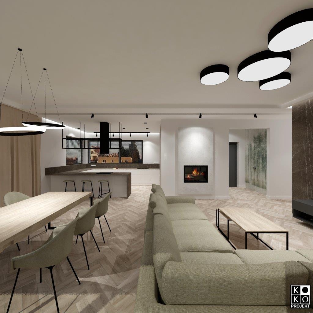 Salon z otwartą kuchnią w domu w Mierzynie. Jasne wnętrze z drewnianą podłogą w jodełkę, kominkiem i nowoczesnym oświetleniem. Widok na okno z zielenią.