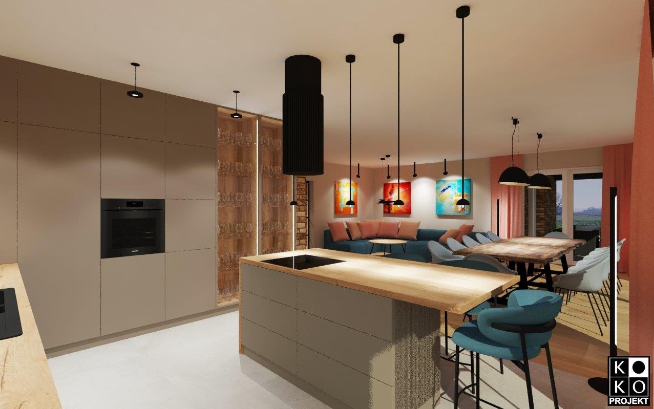 Wnętrze domu: kuchnia z wyspą, salon z sofą i jadalnia z drewnianym stołem. Nowoczesne oświetlenie, obrazy na ścianach. Projekt kuchni w Zagórzu, 2024.