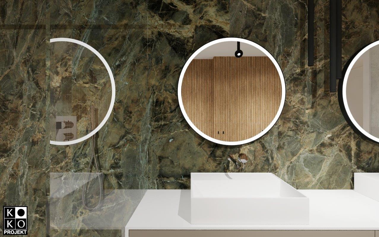 Nowoczesna łazienka z zielonym marmurem, okrągłymi lustrami z podświetleniem LED i białą, geometryczną umywalką nablatową. Minimalistyczny design.