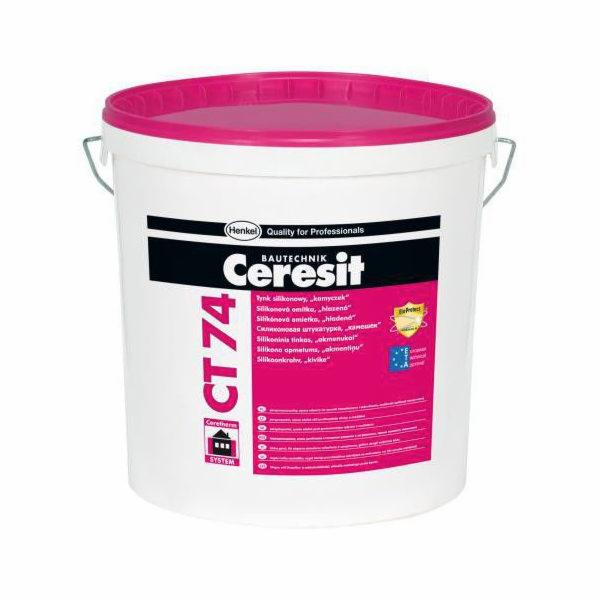 Wiadro białej farby elewacyjnej Ceresit CT 74 z różowym wieczkiem, przeznaczonej do tynków silikonowych, z widocznymi napisami w różnych językach.