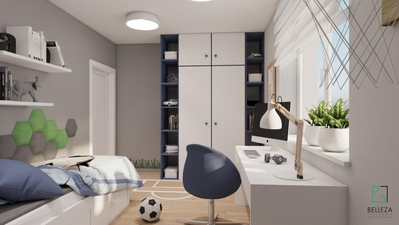 Pokój młodzieżowy z białymi meblami, biurkiem przy oknie, łóżkiem z wezgłowiem z szarych i zielonych heksagonów oraz piłką nożną na podłodze.