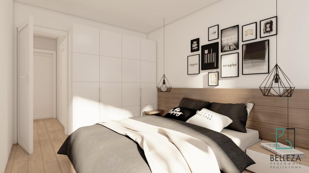 Nowoczesna sypialnia z łóżkiem małżeńskim, drewnianym zagłówkiem, galerią czarno-białych grafik na ścianie oraz minimalistycznymi lampami wiszącymi w kształcie diamentów, obok łóżka szafka nocna...