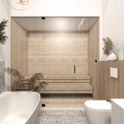 Nowoczesna łazienka z sauną, wykończona drewnem i płytkami lastryko, z minimalistyczną armaturą i dekoracyjnymi trawami pampasowymi. Na ścianie widoczne logo firmy.
