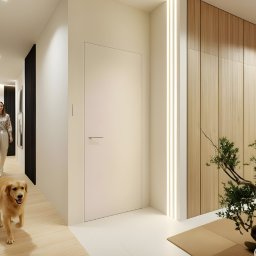 Aranżacja, projektowanie wnętrz MIA PROJEKT Maria Leśna - Nowoczesny korytarz z drewnianą ścianą, oświetleniem LED, minimalistycznymi drzwiami i psem rasy golden retriever, który biegnie w stronę kamery. W tle kobieta.