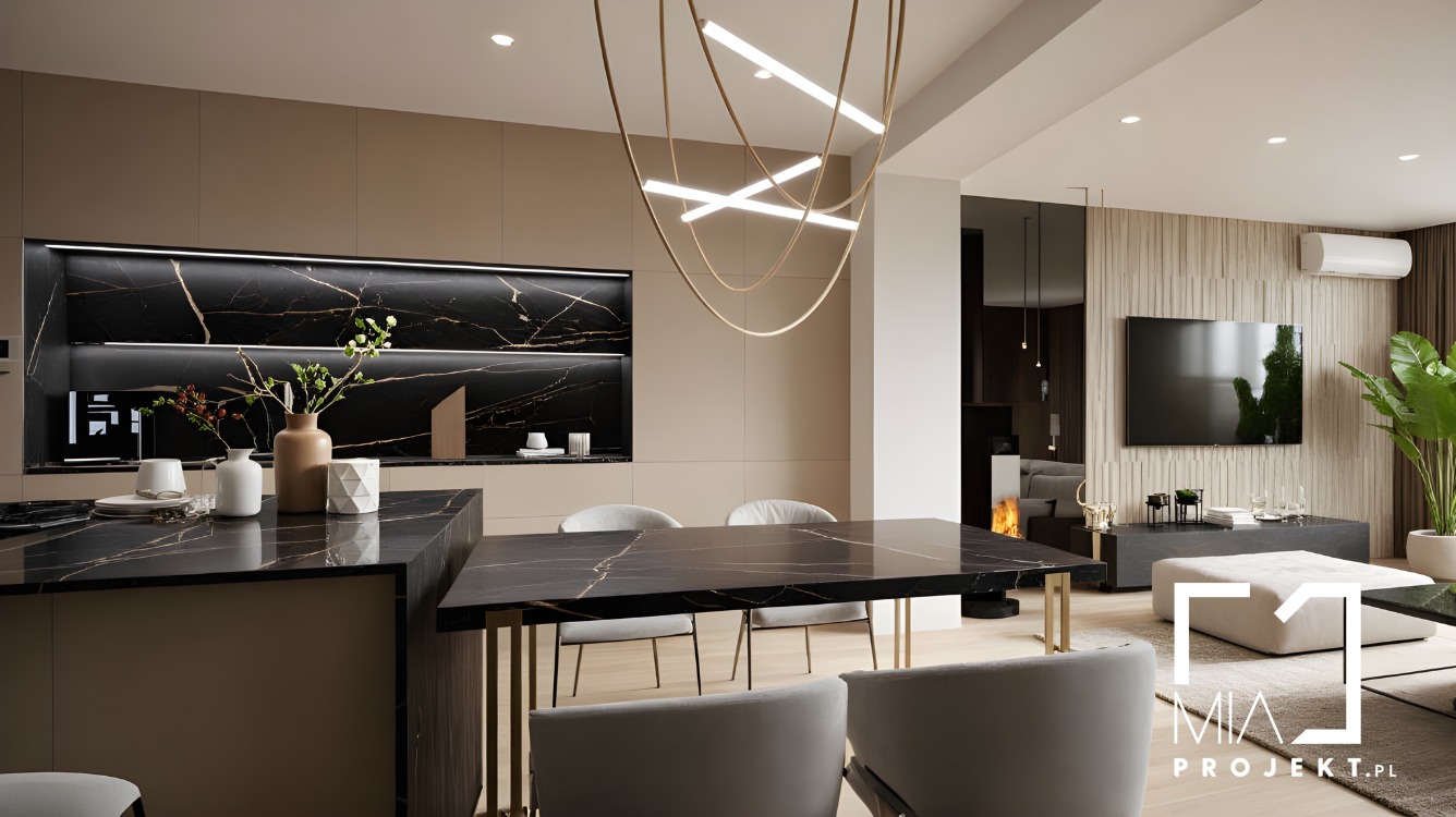 Eleganckie wnętrze otwartej kuchni z jadalnią w Katowicach. Czarny marmur na blacie i ścianie, nowoczesne oświetlenie, minimalistyczny design.