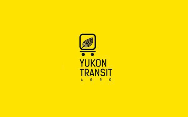 Logo firmy Yukon Transit Agro na jaskrawożółtym tle, przedstawiające schematyczny wózek z liściem w kwadracie.