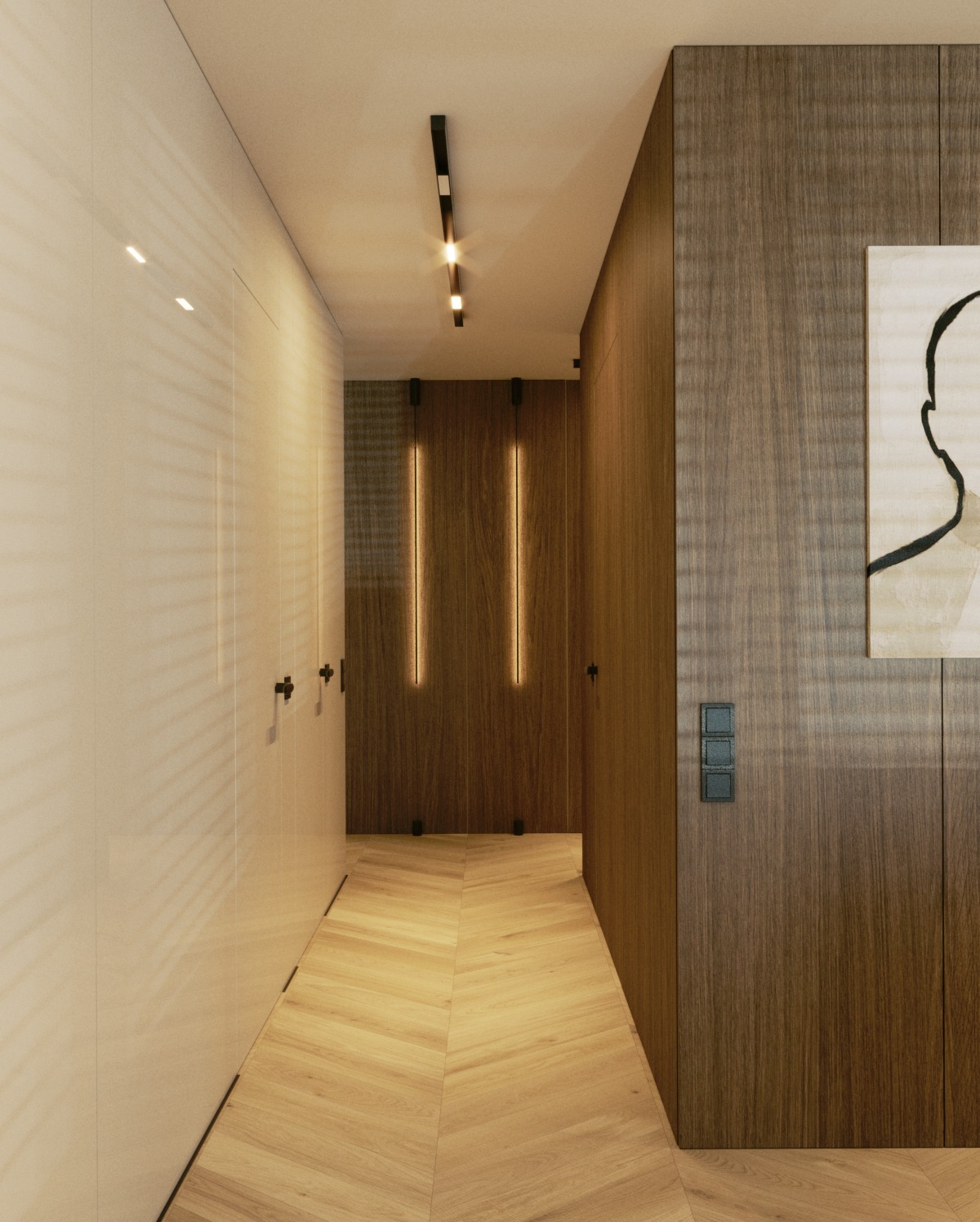 Nowoczesny korytarz z drewnianą podłogą ułożoną w jodełkę, białe szafy w zabudowie po lewej, ciemne drewniane panele po prawej z włącznikami światła, pionowe lampy ledowe i abstrakcyjny obraz...