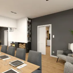 Nowoczesne wnętrze: stół jadalny z nakryciami, kominek z drewnem, szara ściana z rośliną doniczkową i fotelami, przesuwne drzwi do kuchni.