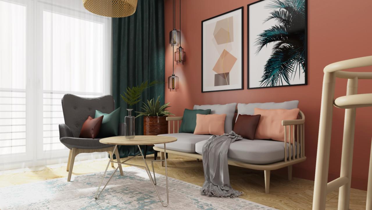 Aranżacja salonu w ciepłych barwach z terakotową ścianą, szarym fotelem, beżową sofą z poduszkami w odcieniach brązu, zieleni i pomarańczy, stolikiem kawowym na metalowych nogach, dywanem...