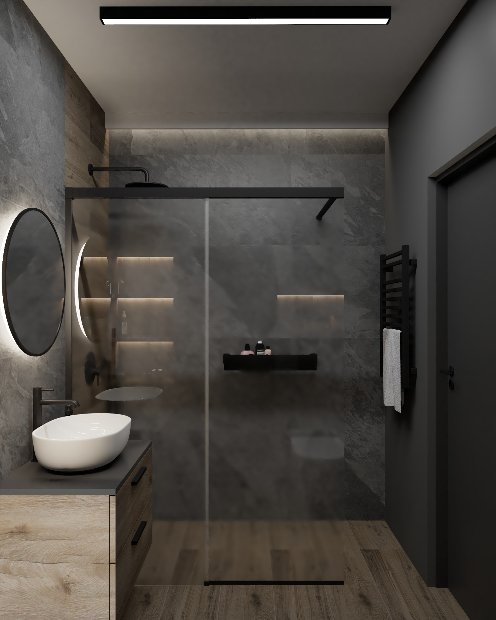 Nowoczesna łazienka z szarą kamienną ścianą, drewnianą podłogą i szafką pod umywalką z drewnianym frontem, okrągłe lustro z podświetleniem LED, kabina prysznicowa typu walk-in z czarnymi ramami...
