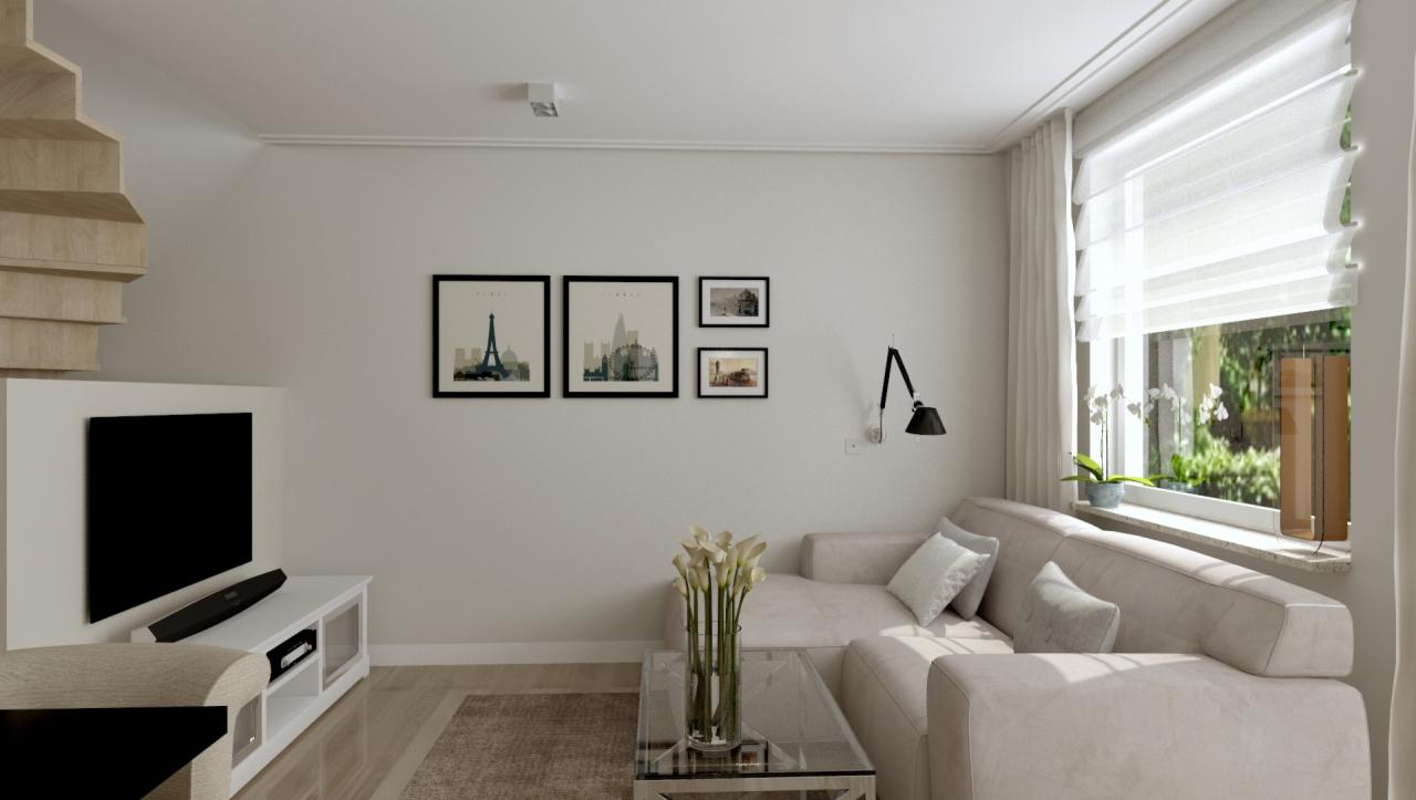 Jasny salon z narożną sofą, stolikiem kawowym ze szklanym blatem, telewizorem na białej komodzie, schodami z jasnego drewna i dekoracyjnymi obrazami z motywami miejskimi na ścianie.