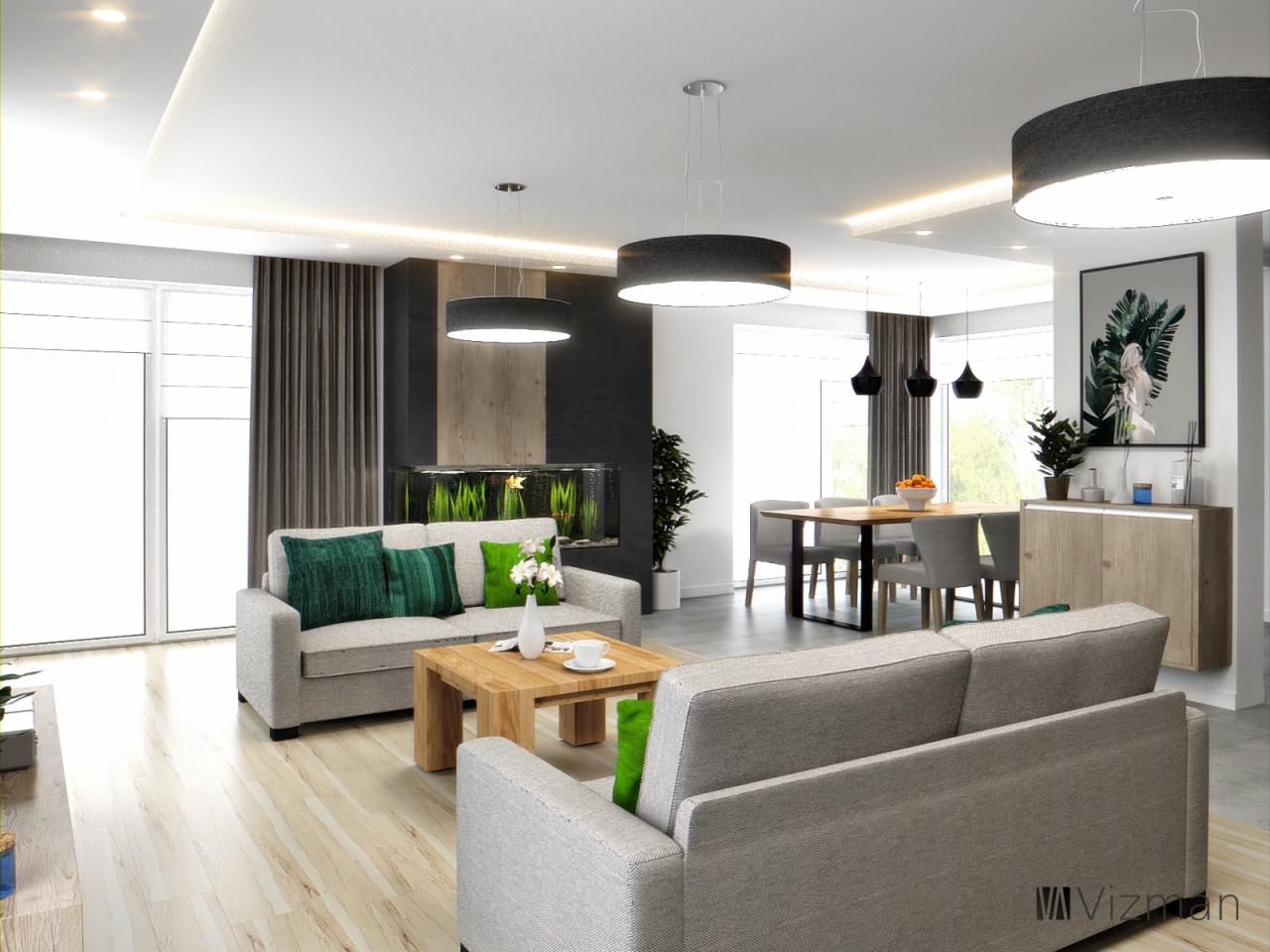 Jasne, przestronne wnętrze salonu z akcentami zieleni, w tym poduszkami na sofach i roślinami, z akwarium w tle i jadalnią w oddali, oświetlone nowoczesnymi lampami wiszącymi.