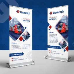 Dwa roll-upy firmowe z logo Gamtech, prezentujące ofertę dla przemysłu kolejowego, z ilustracją nowoczesnego pociągu i elementami silnika, na tle gradientu niebieskiego.