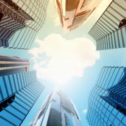 Wysokie, nowoczesne biurowce z niebieskiego szkła i betonu, sfotografowane z perspektywy żabiej, z chmurami na jasnym niebie.