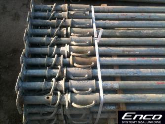 Stos metalowych podpór budowlanych, spiętych białą taśmą, z widocznym logo ENCO SYSTEMY SZALUNKOWE w prawym dolnym rogu.