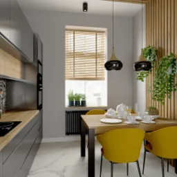 Wizualizacja kuchni z czarnymi szafkami, drewnianym blatem i geometrycznymi płytkami nad indukcją, żółte krzesła przy drewnianym stole, wiszące lampy i rośliny doniczkowe.