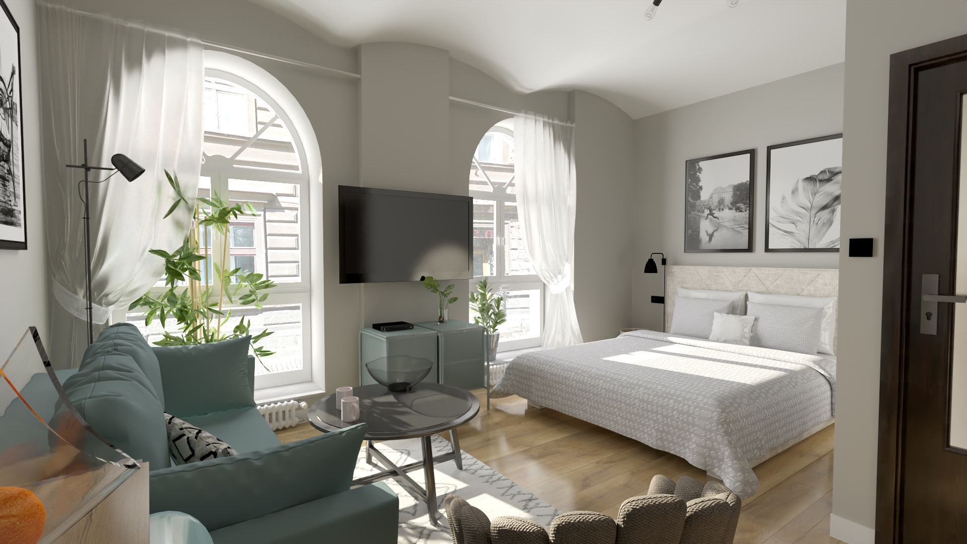 Jasne wnętrze sypialni z sofą, dwoma oknami łukowymi z białymi zasłonami, telewizorem na ścianie, łóżkiem z wzorzystą narzutą i dywanem w geometryczne wzory.