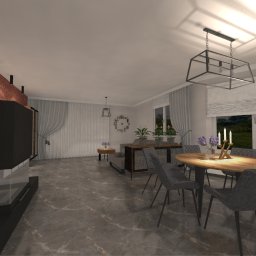 Decor Studiosanok - Przestronny salon z ceglaną ścianą, nowoczesnym kominkiem, marmurową podłogą i drewnianym stołem jadalnym z szarymi krzesłami, oświetlony wiszącą lampą w stylu industrialnym.