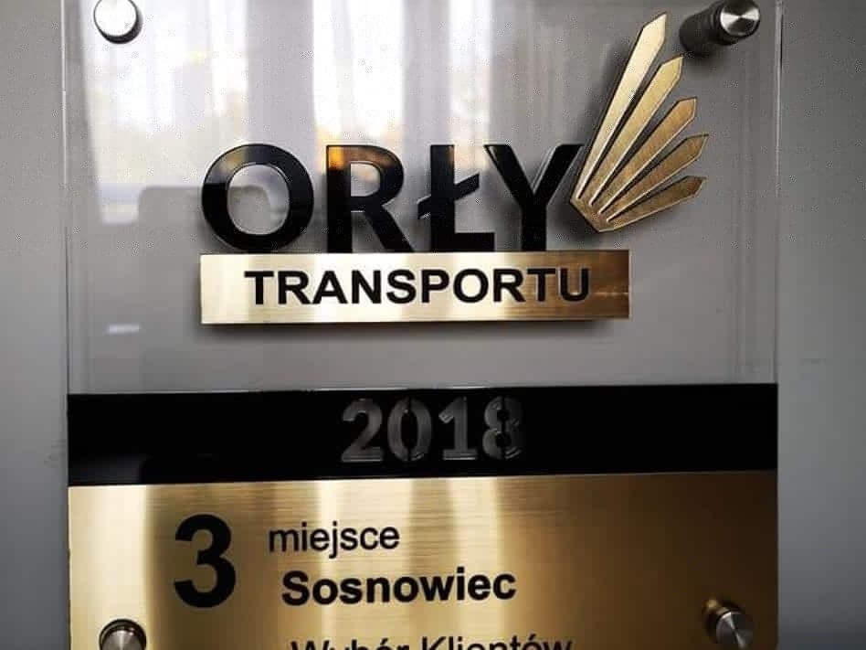Tablica z logo firmy 'Orły Transportu', nagrodzona 3 miejscem w Sosnowcu w 2018 roku.