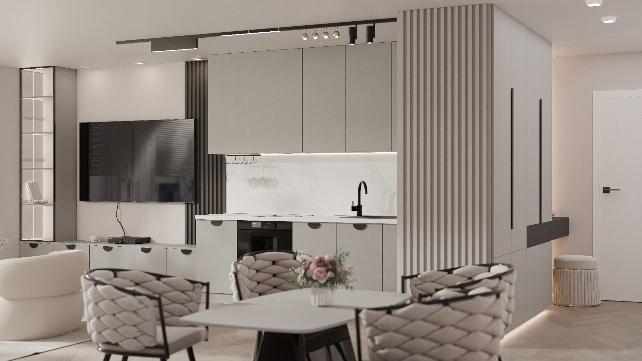 Nowoczesna kuchnia w odcieniach szarości z czarnymi akcentami, oświetleniem punktowym i dekoracyjnymi lamelami. Stół z kwiatami i krzesła w stylu glamour.