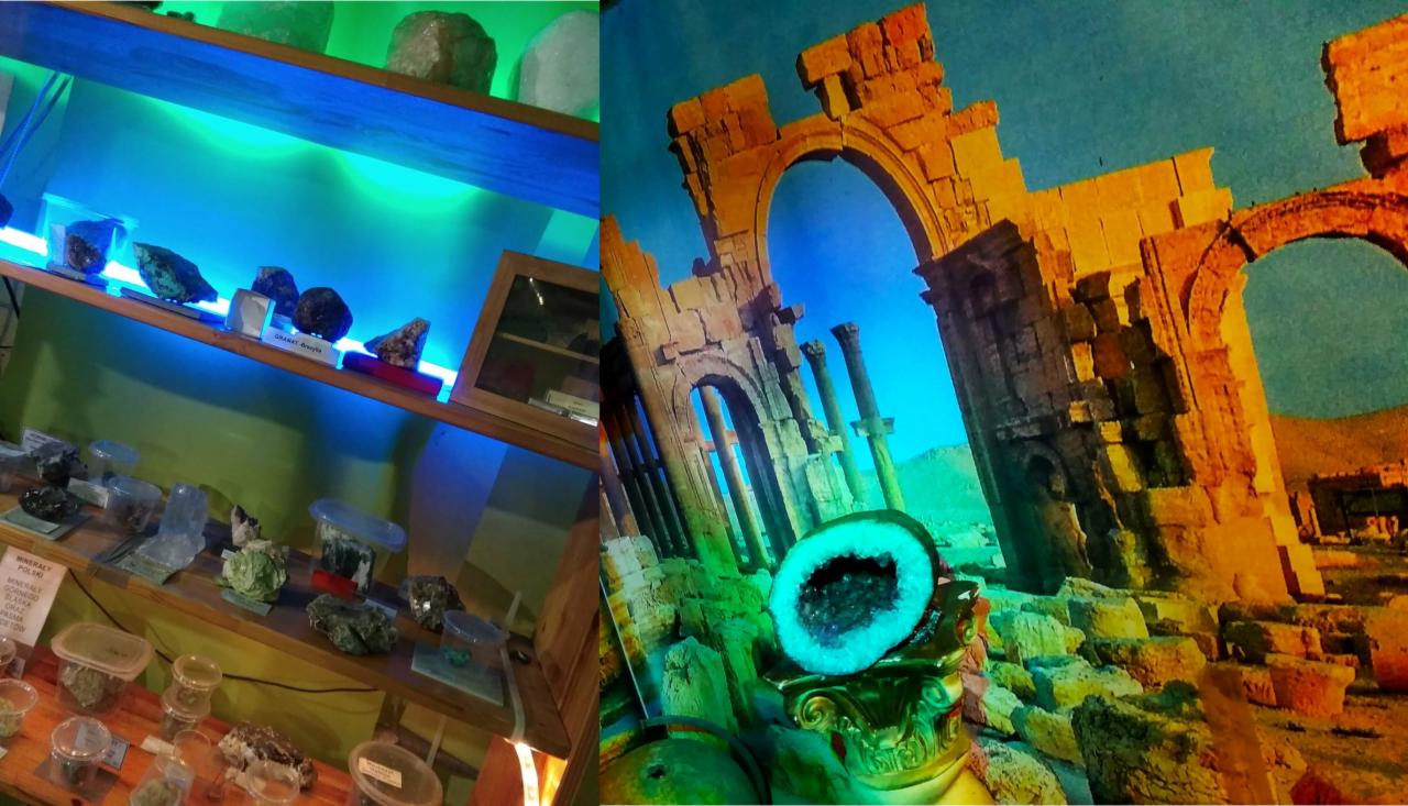 Ekspozycja minerałów i kamieni szlachetnych w Wyrzysku: półki podświetlone niebieskim światłem prezentują różnorodne okazy, obok widoczna grafika przedstawiająca starożytne ruiny z umieszczoną...